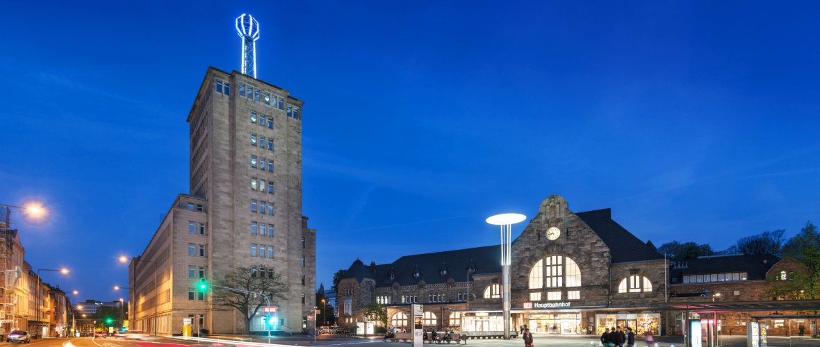 Central station, administration building and weather pillar at night