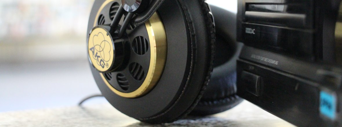 Headphones leaning against the music system