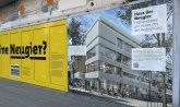 Yellow foil with "Curiosity" printed on it and foil with a view of the future façade.