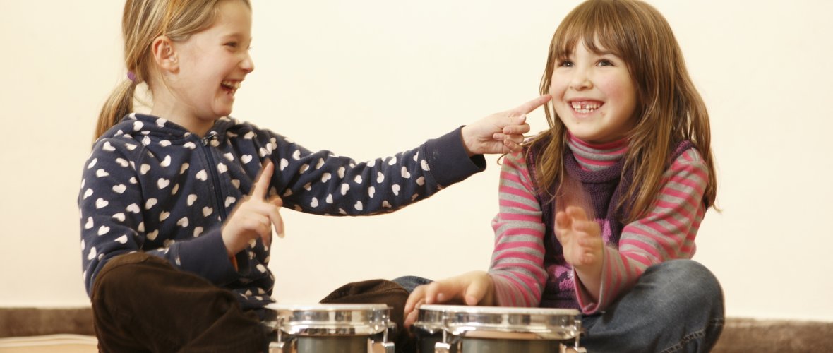 laughing girls drumming