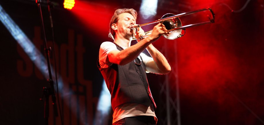 A trombone player on stage