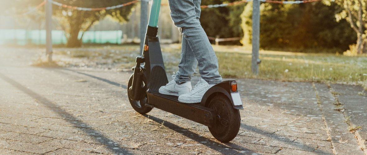 Person on e-scooter Person on e-scooter