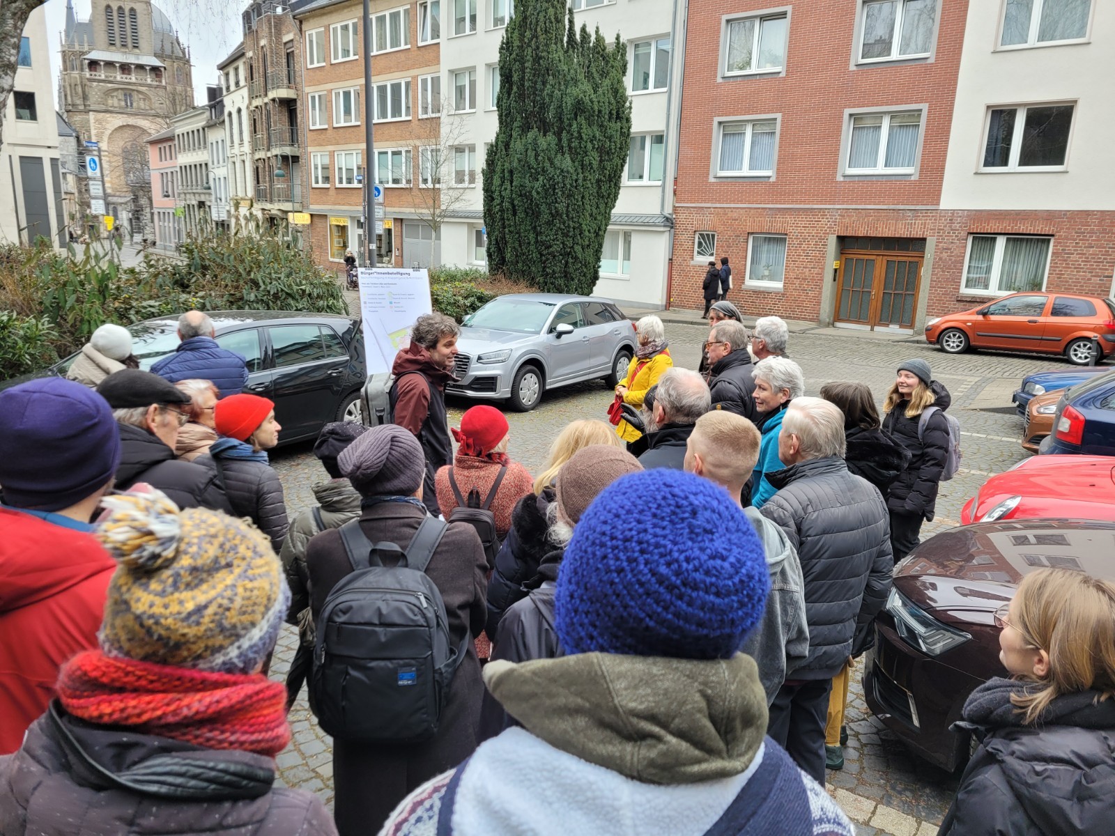 Participants in a public engagement initiative are learning about the redesign of Klappergasse and Rennbahn in Aachen on site.
