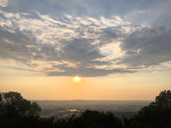 View over Aachen with rising sun and some clouds