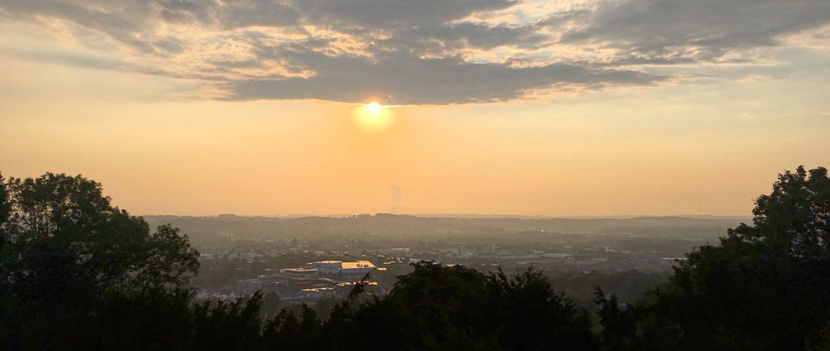 View over Aachen with rising sun and some clouds