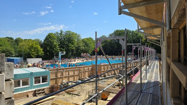The outdoor pool is open despite the major construction site.