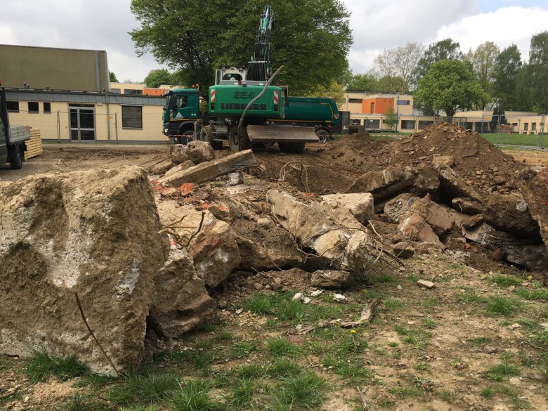Many concrete foundations have been found in the ground.