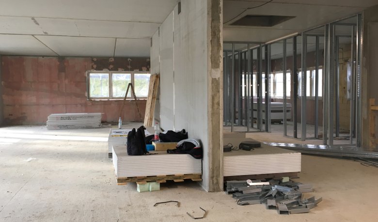 The interior plastering and drywall work has begun.