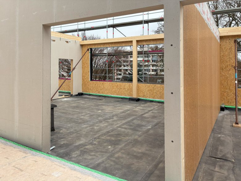 The wooden panel walls are erected.