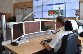 In the middle of service in the control center. Current and important information on all possible relevant areas can be seen on 12 screens at all times. These can be viewed from any workstation. An employee sits at his or her desk.