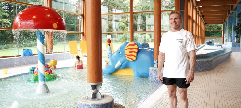 Deputy pool manager Ralf Taubert stands in front of the baby pool with the slides and other play equipment in the South Swimming Pool.