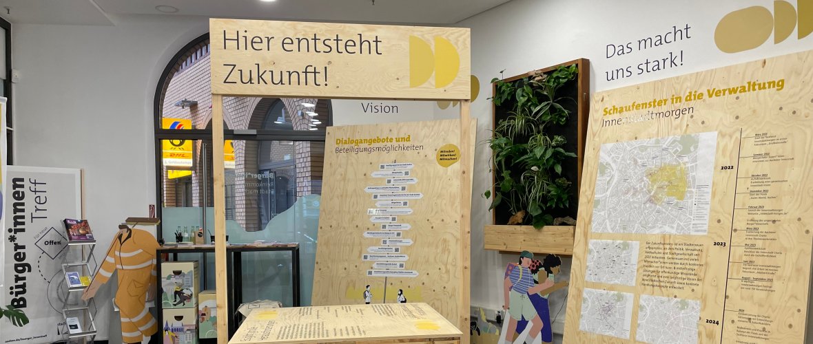 Interior view of the Bürger*innentreff in Aachen with display boards on the topic of the future.