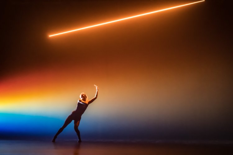 Person dances on a stage.