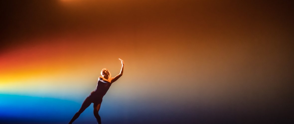 Person dances on a stage.