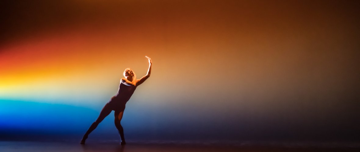 Person dances on a stage.