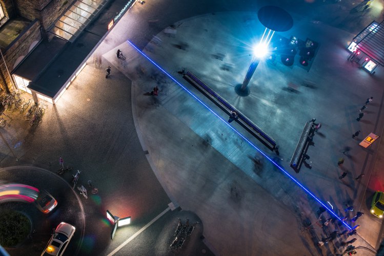 Drone shot of the station forecourt in aachen with futuristic light strips on the ground.