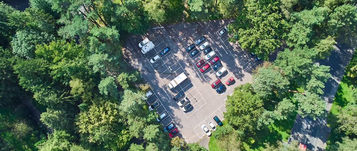 Aerial view of the parking lot in the urban green belt.