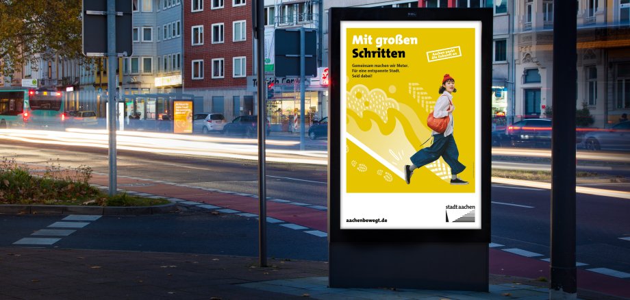 Bus stop with busin the twilight with billboard in the foreground Kaiserplatz Aachen