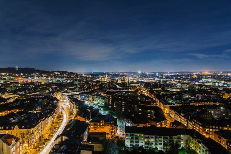 Beautiful night shot of Aachen with glittering lights from the direction of St. Jacob's Church.