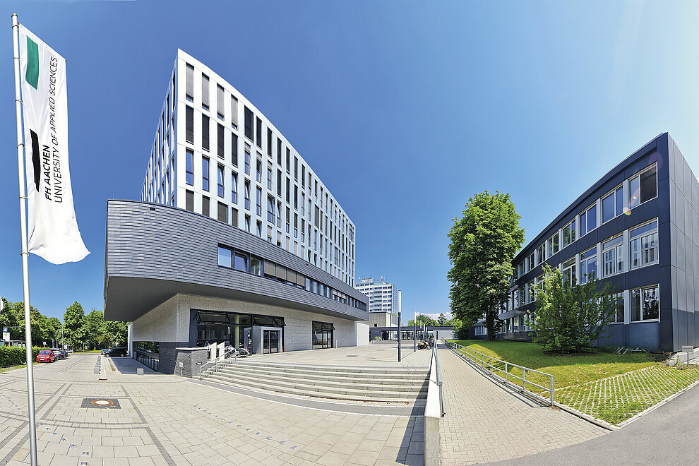 FH Aachen Building of the FH Aachen. Flags with the FH logo can be seen in the foreground.