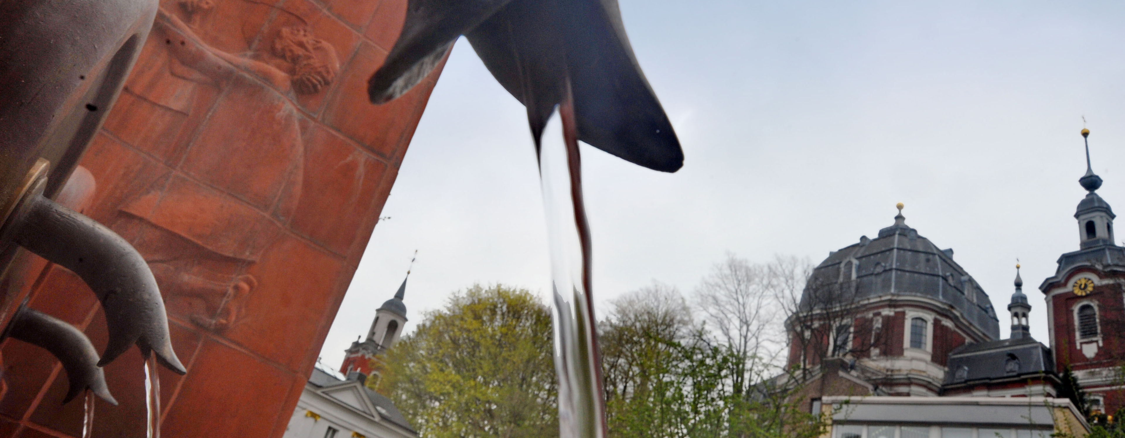 Close-up: Fountain in Burtscheid. Water flows from a tap.
