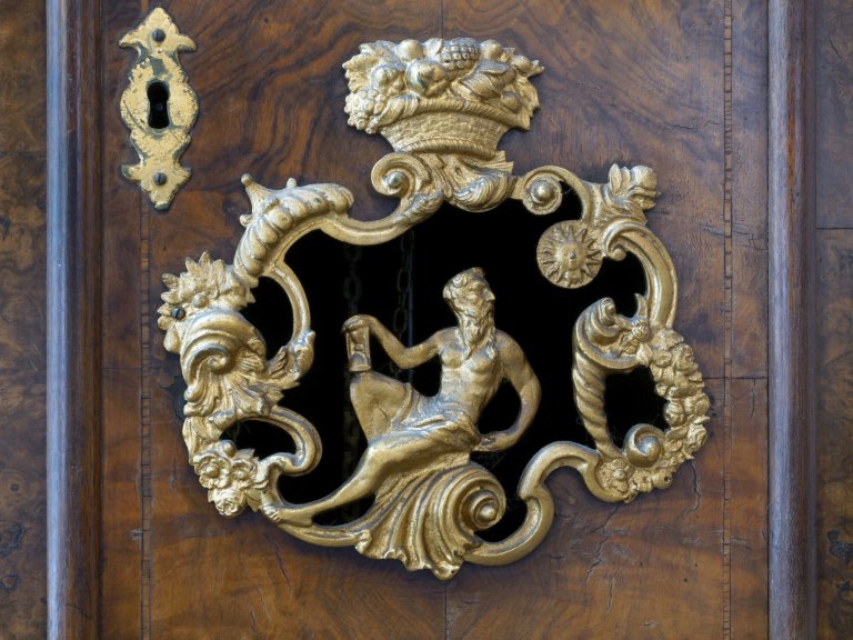 Dutch grandfather clock detail view of Kronos with hour glass, 18th century