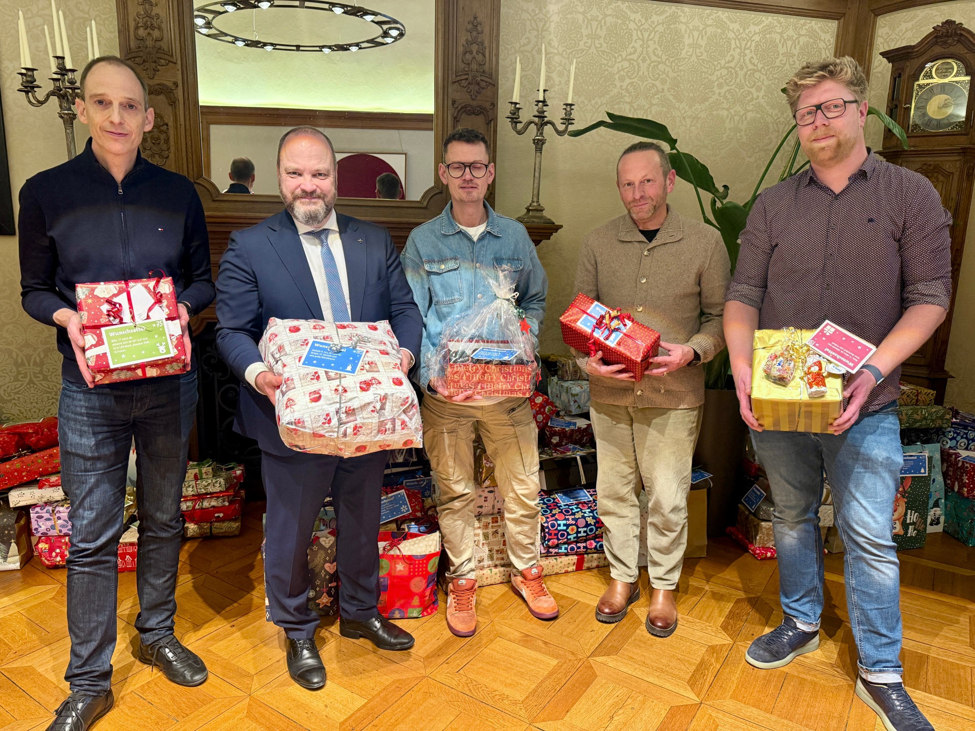 Five men with Christmas presents