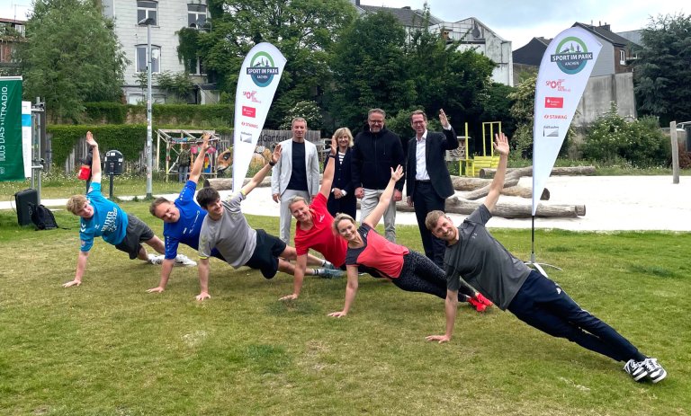 People doing sports on a meadow