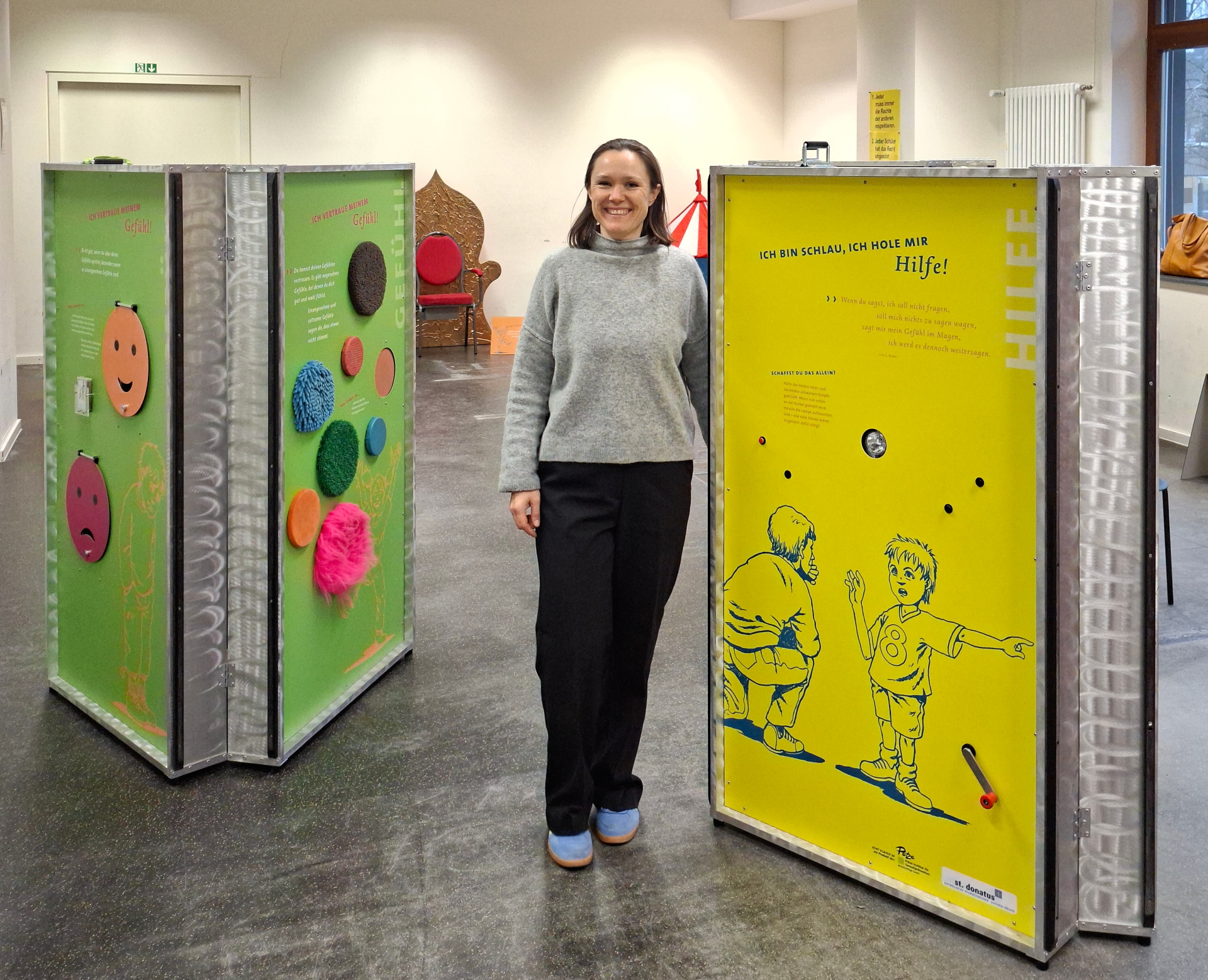 Woman standing in front of movable walls