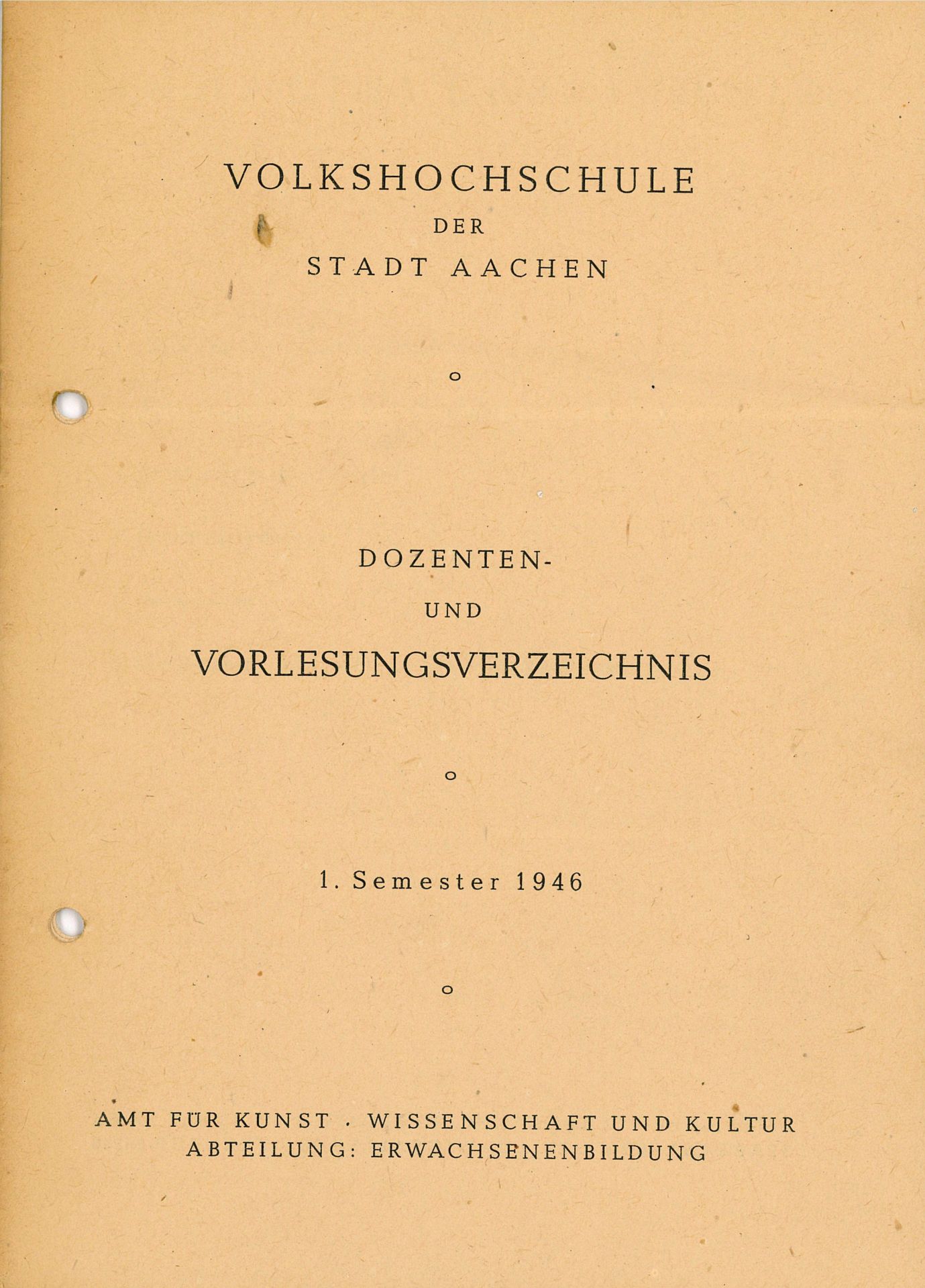 A yellowed, old, perforated piece of paper; the title page of the first VHS course catalog.