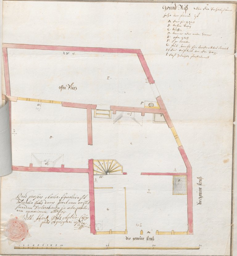 A floor plan of a residential building with a seal and a handwritten legend