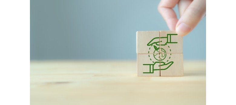 Sustainability cube is taken with fingers
