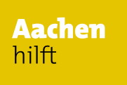 Gelber Hintergrund mit schwarz-weißer Schrift. "Aachen hilft" ist zu lesen.
